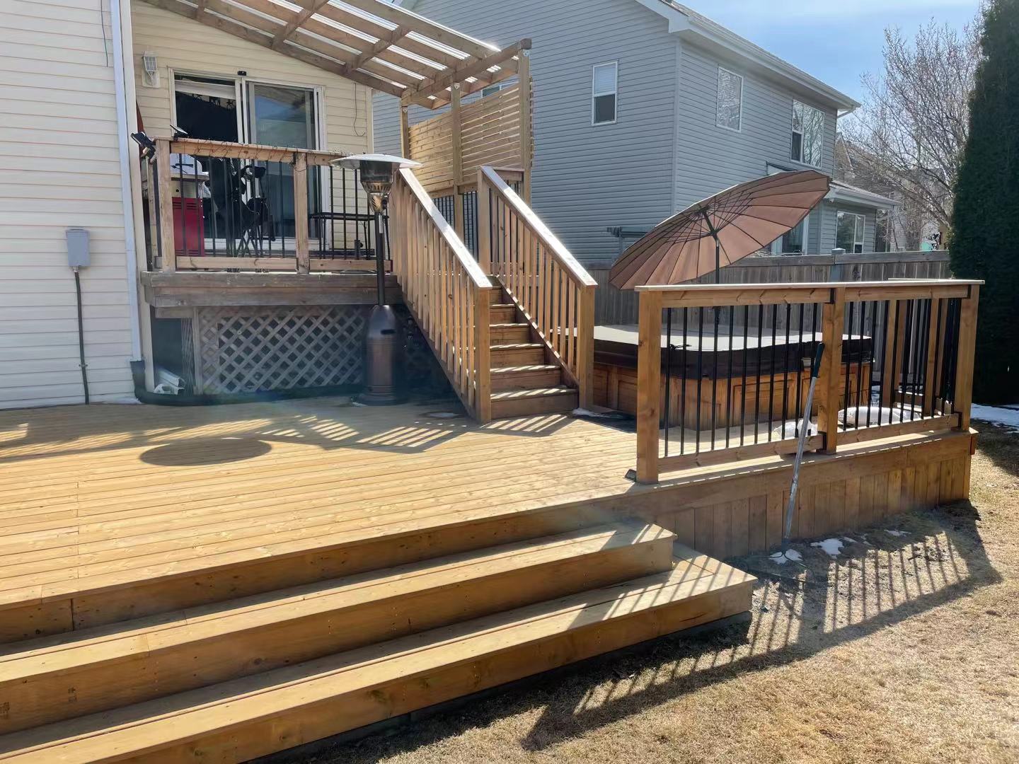 a newly constructed wood deck in the backyard