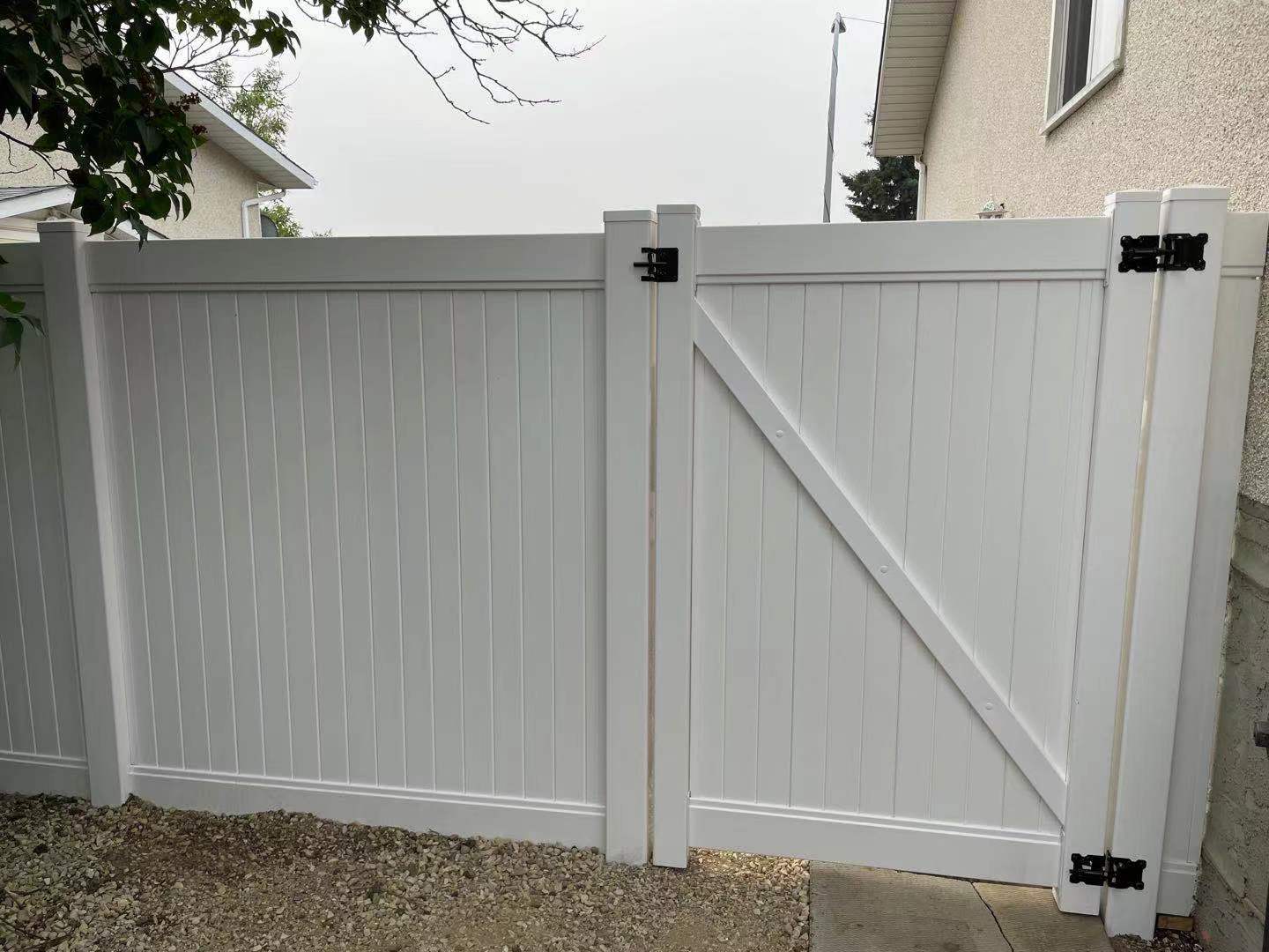 a newly constructed wood fence in the backyard