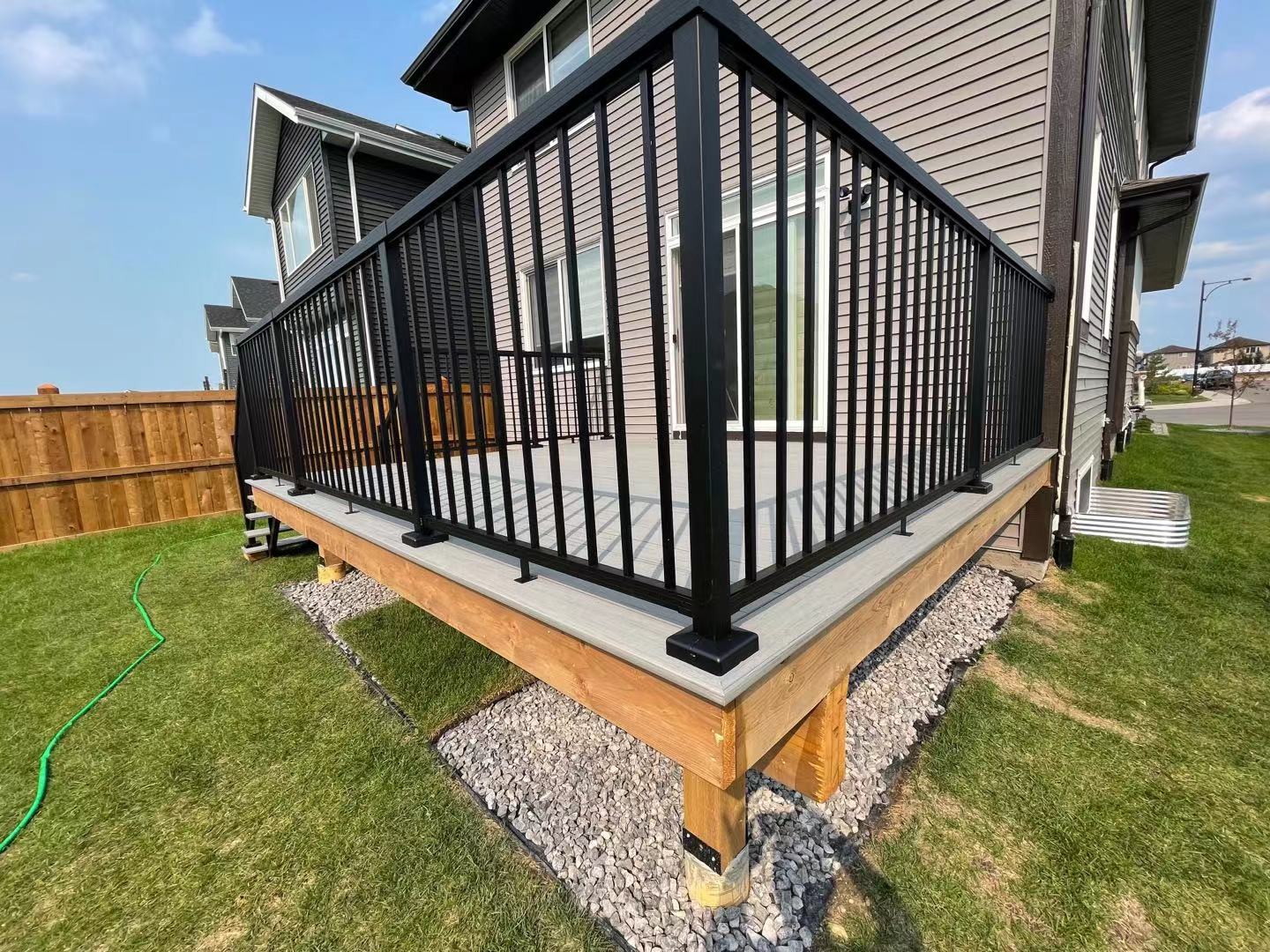 a newly constructed wood fence in the backyard