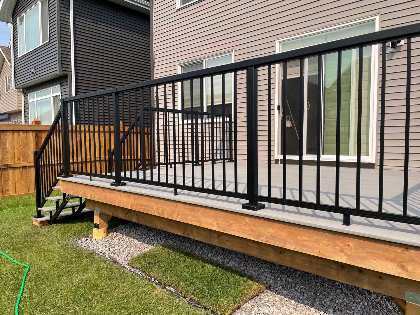 a newly constructed wood fence in the backyard