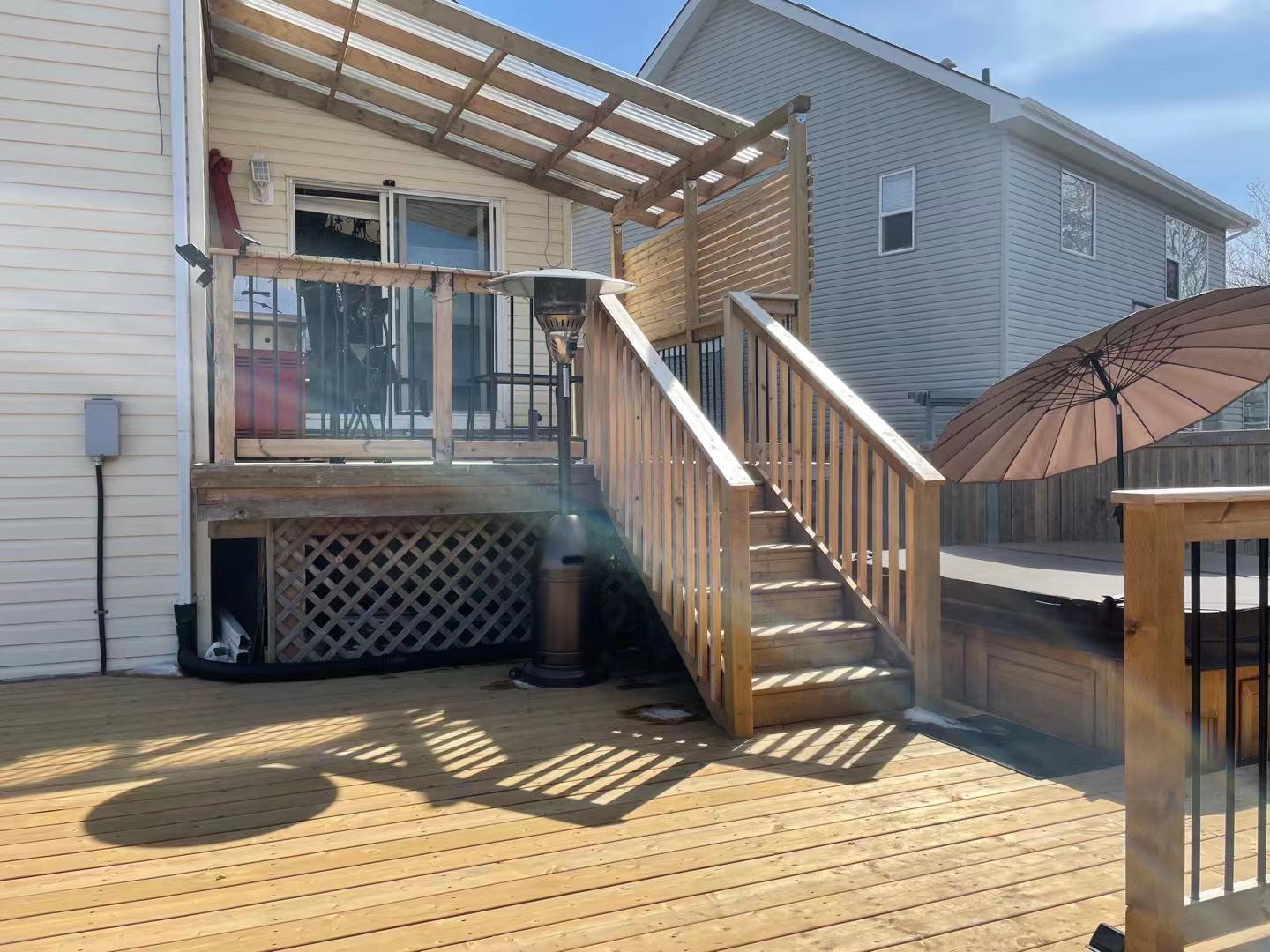 a newly constructed wood deck in the backyard