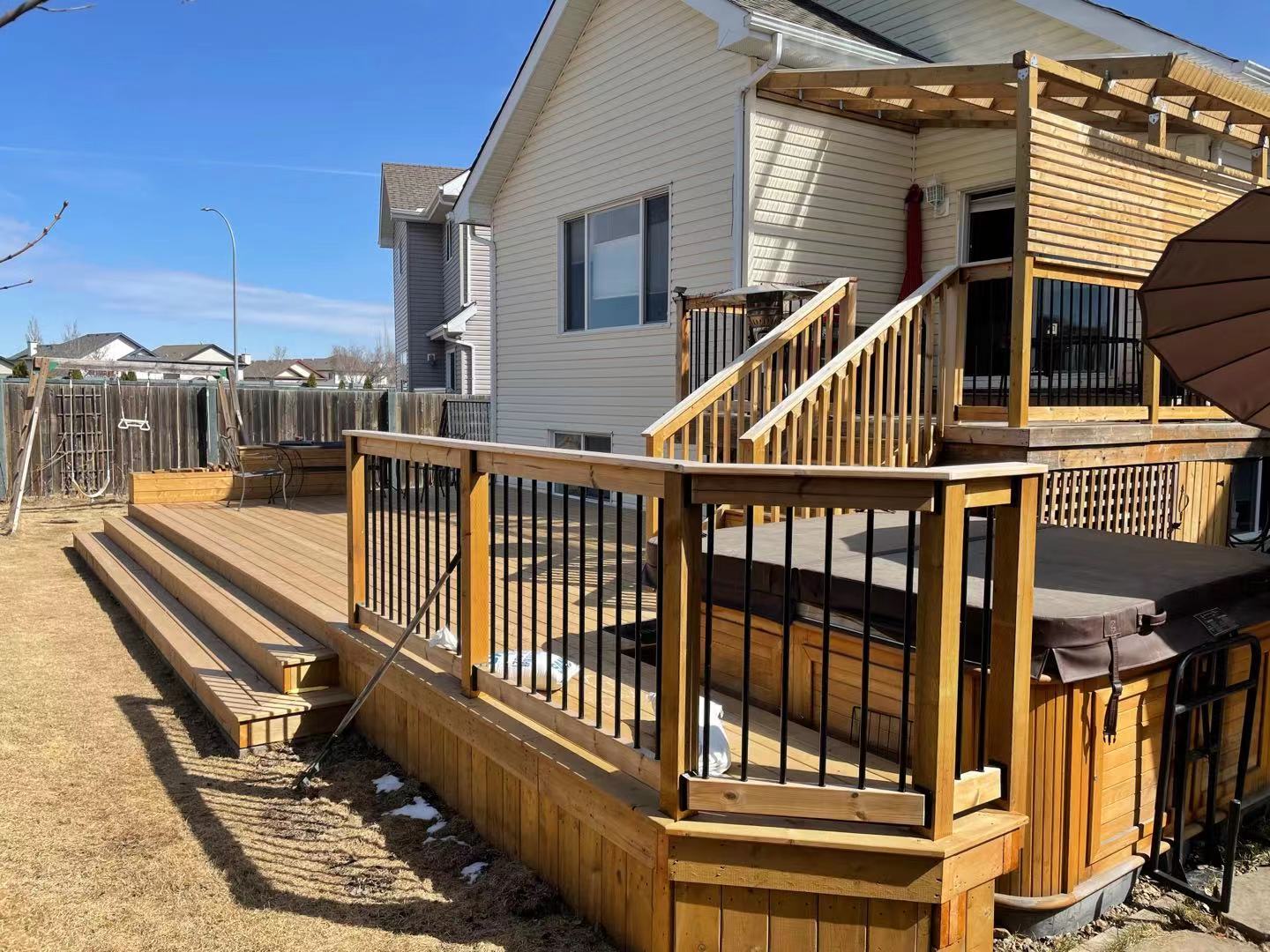 a newly constructed wood deck in the backyard