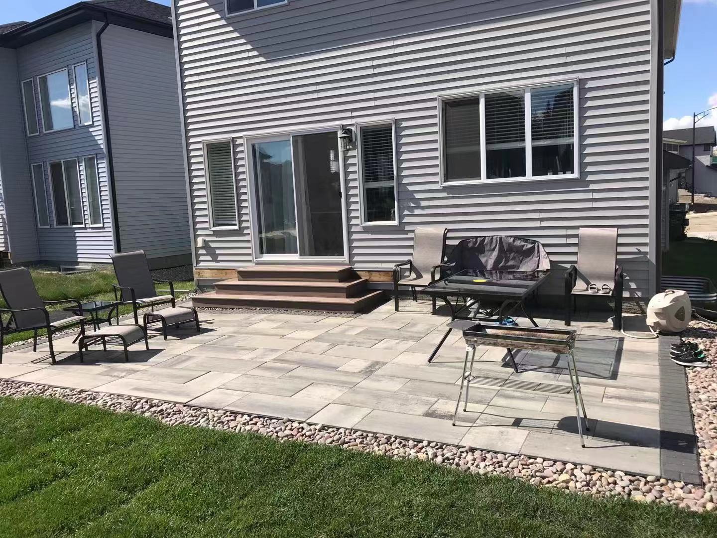a newly constructed wood deck in the backyard